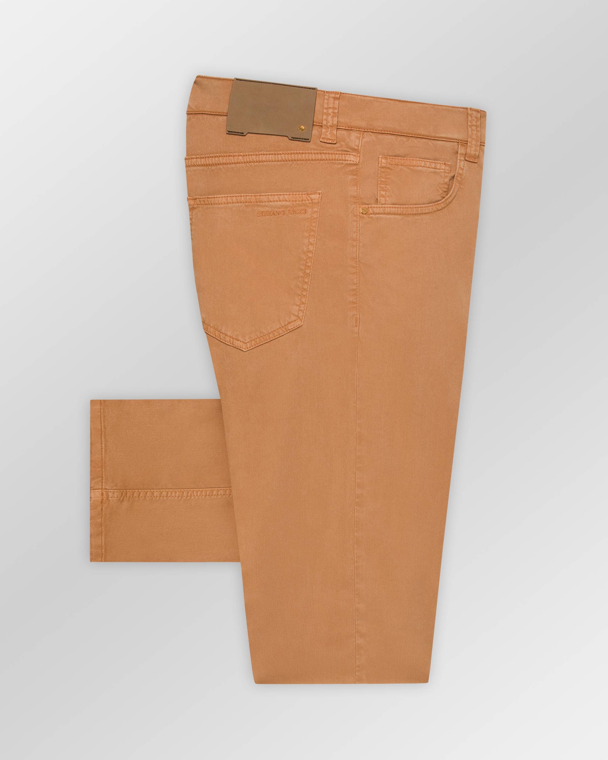 Camel-colored five-pocket trousers with belt loops, a light brown leather-like patch, gold-toned rivets, and "STEFANO RICCI"