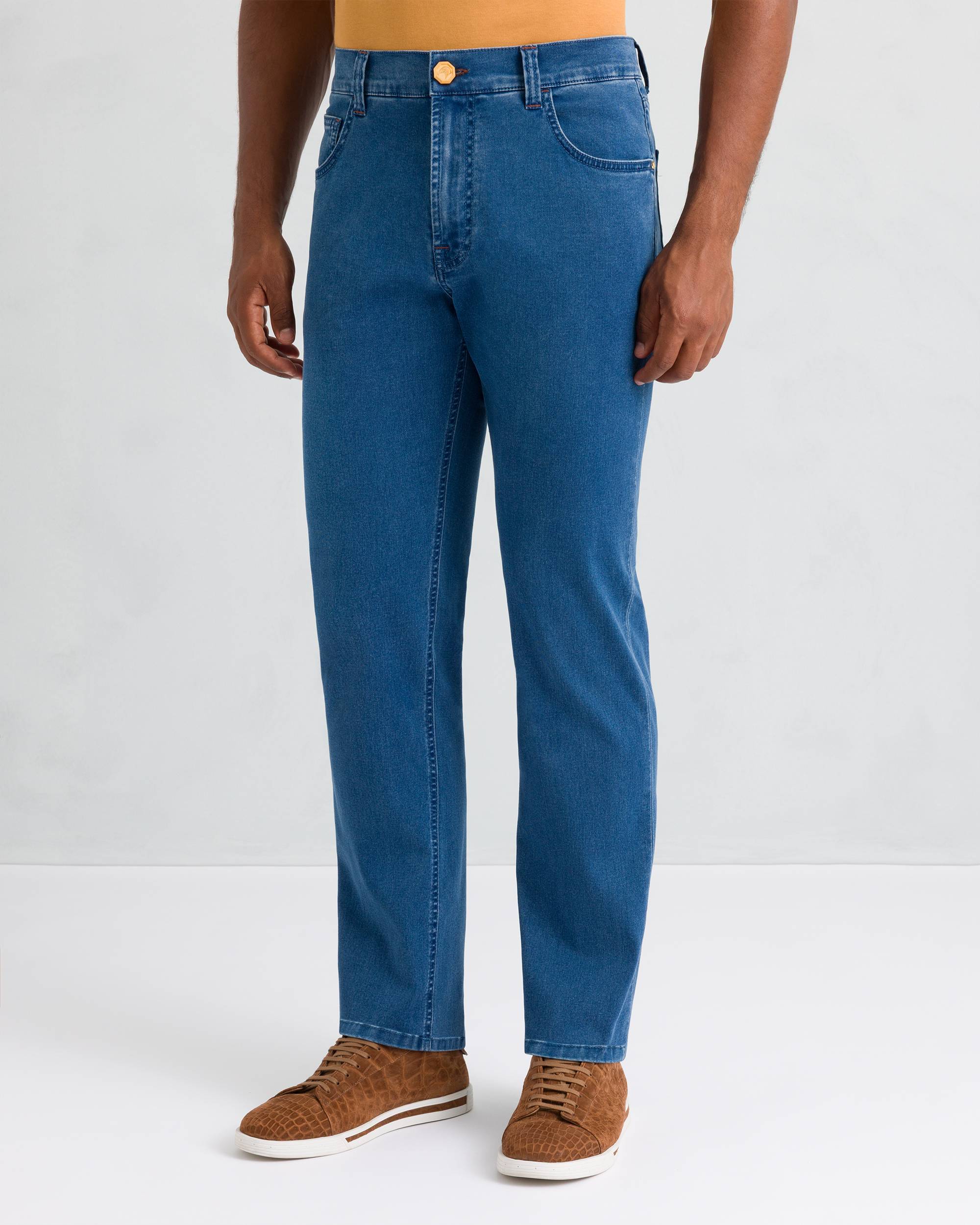 Light blue classic wash straight-leg trousers with five pockets, belt loops, and a gold-toned button closure.