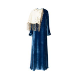 Capture the essence of regal sophistication with this architectural velvet gown from MIJAD FASHION.