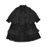 MIMISOL girls black tiered dress with broderie anglaise details, sequins, long sleeves, and ruffled neckline.