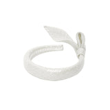 MiMiSol beige padded headband for girls featuring a large decorative side knot and bow with a white lace interior lining.