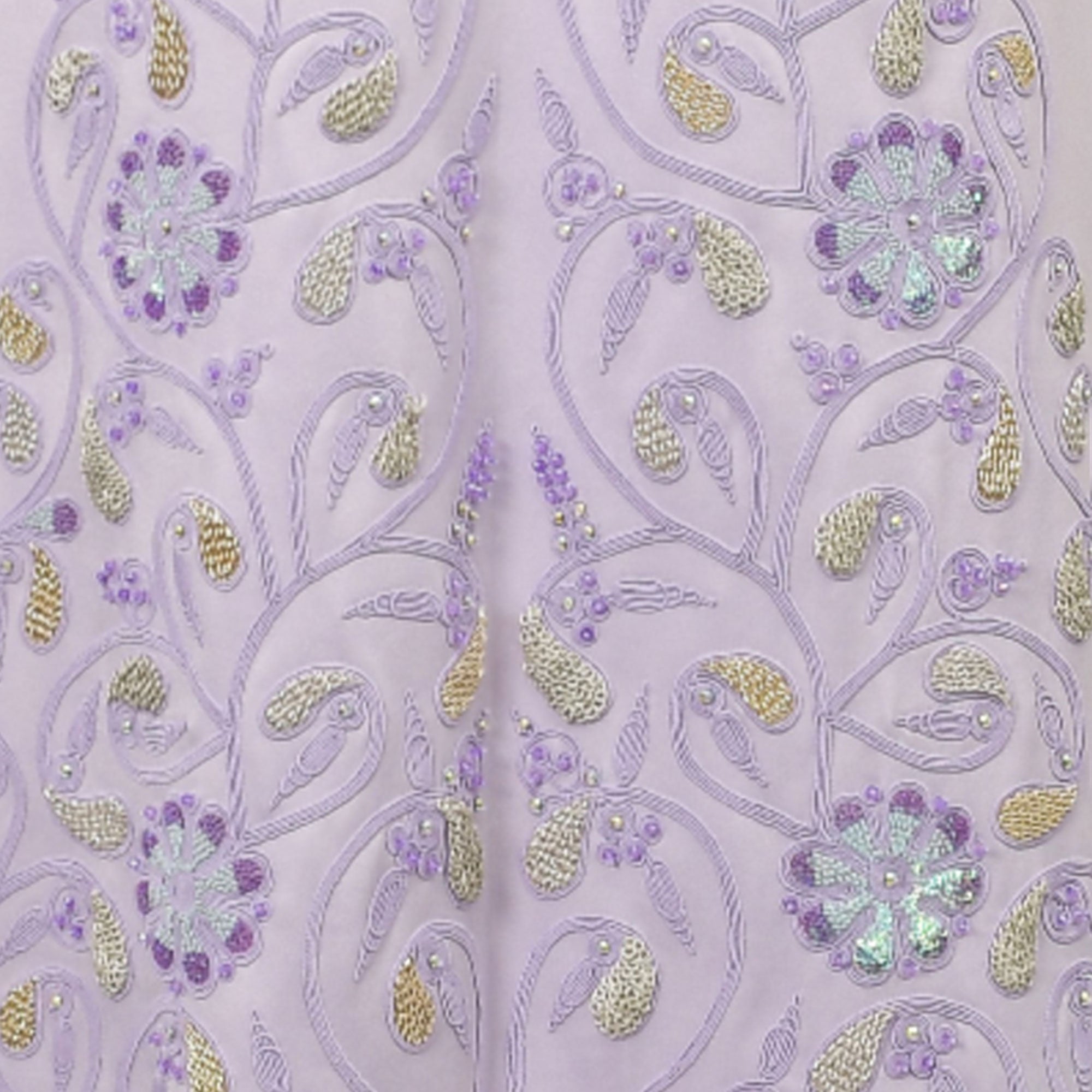 Lavender dress with intricate purple vine embroidery, silver-toned and gold-toned leaves, purple sequin flowers, and small be