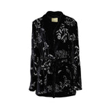Black velvet embroidered jacket by MOMONI with floral detailing, shawl collar, and adjustable tie waist.