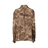 Vintage floral print blouse by MOMONI with long sleeves, button-down front, and soft flowing fabric.