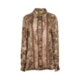 Vintage floral print blouse by MOMONI with long sleeves, button-down front, and soft flowing fabric.