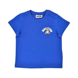 Detailed front view of the blue cotton Moschino T-shirt highlighting the snap-button shoulder and the central Teddy Bear graphic.