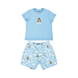 A baby boy's two-piece set featuring a light blue T-shirt with a teddy bear graphic and matching cloud-print shorts.