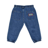 Rear view of the baby denim joggers showing the elasticated waist and the Moschino brand patch on the back pocket.