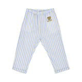 Detailed view of the light blue and white striped linen trousers featuring an elastic waist and a teddy bear patch on the hip.