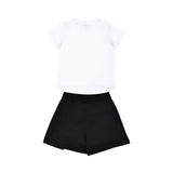The back view of a plain white children's T-shirt and black jersey shorts set.