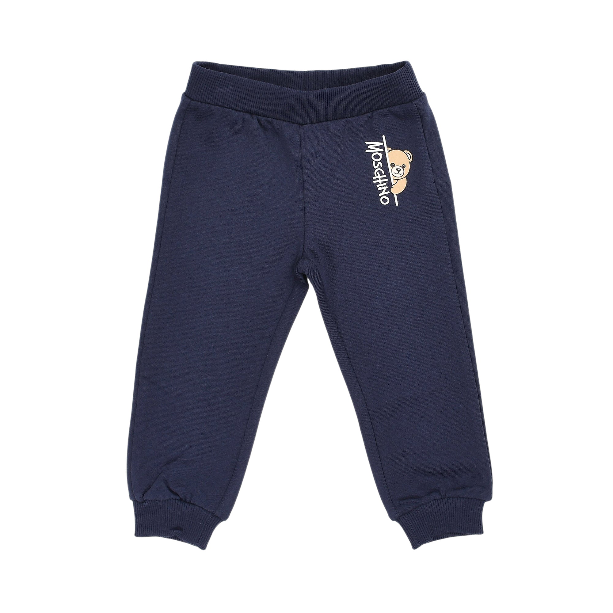 Navy jogging suit pants with ribbed waistband and cuffs. Features a white vertical Moschino logo and a light brown teddy bear