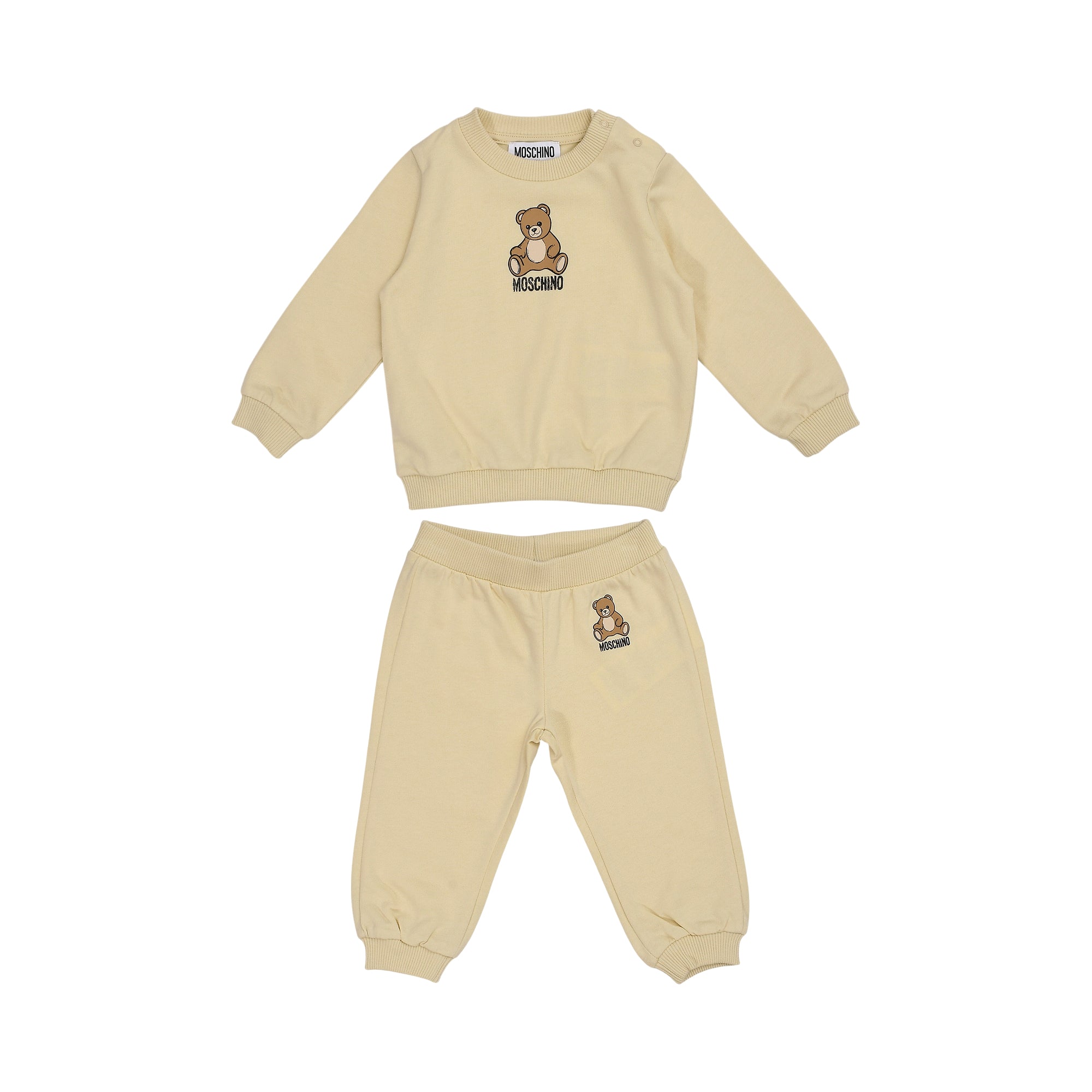 Beige Moschino Kids two-piece jogging suit with a long-sleeved sweatshirt and trousers, both featuring a teddy bear graphic.