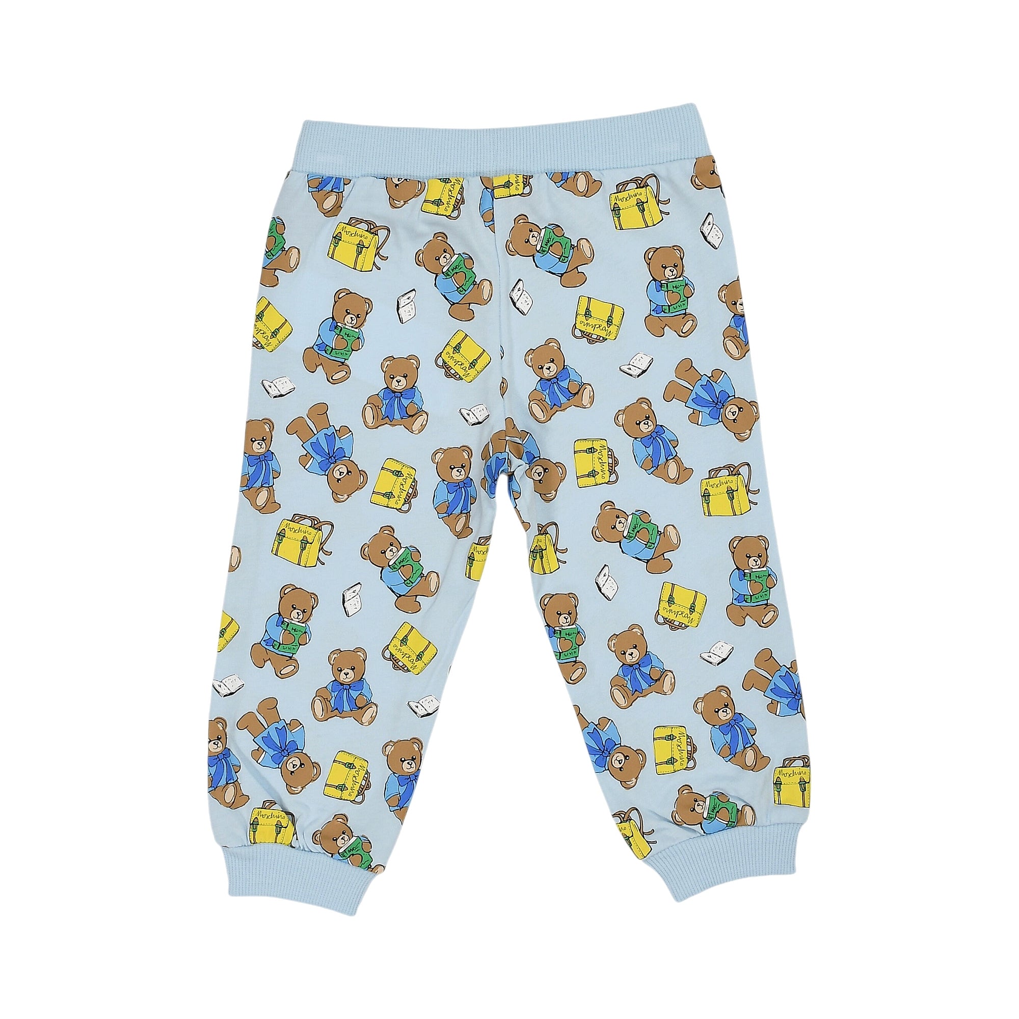 Light blue jogging pants with ribbed waist and cuffs, featuring a pattern of brown teddy bears holding green books and yellow