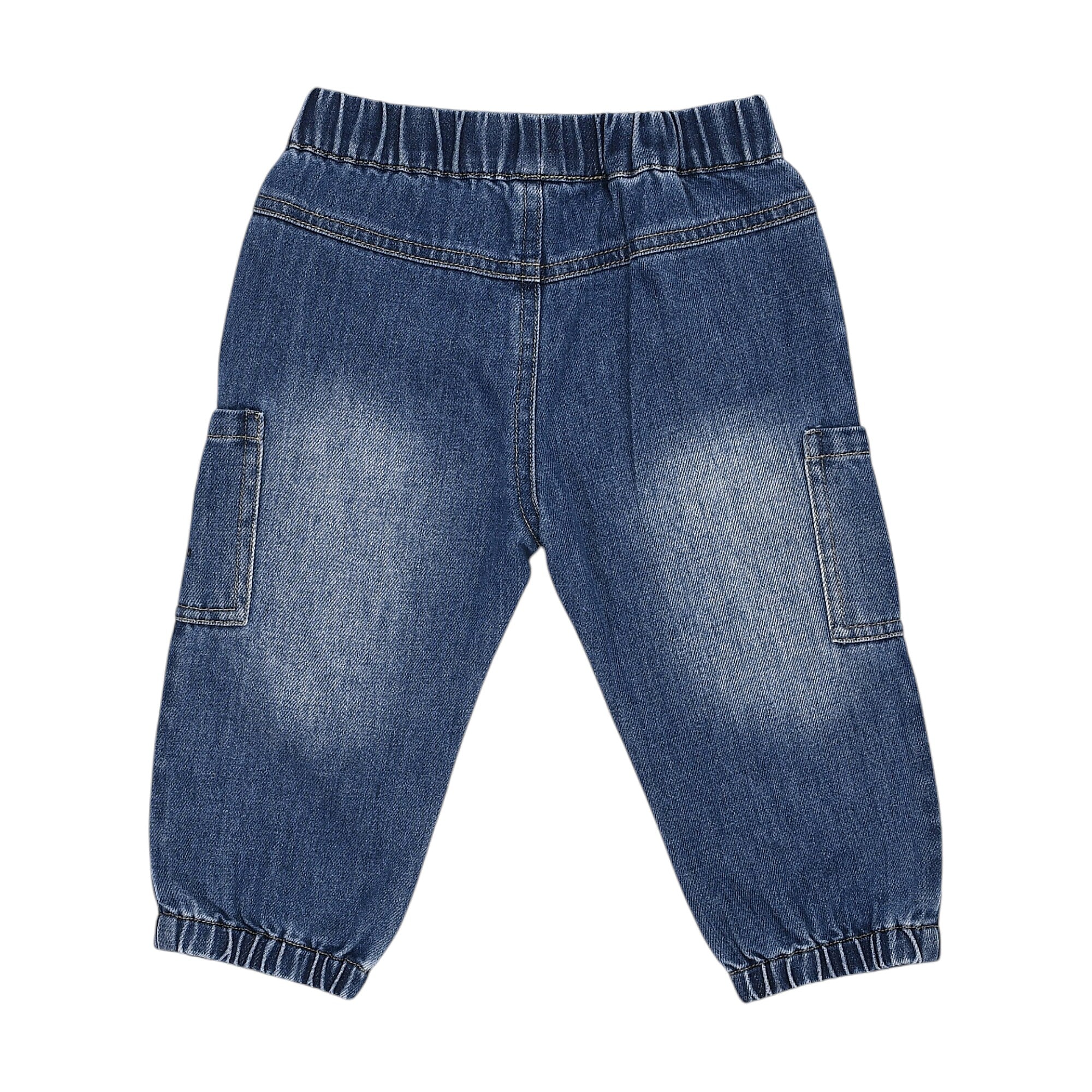 Blue denim jogger-style trousers with elasticated waist and cuffs, and two side cargo pockets.