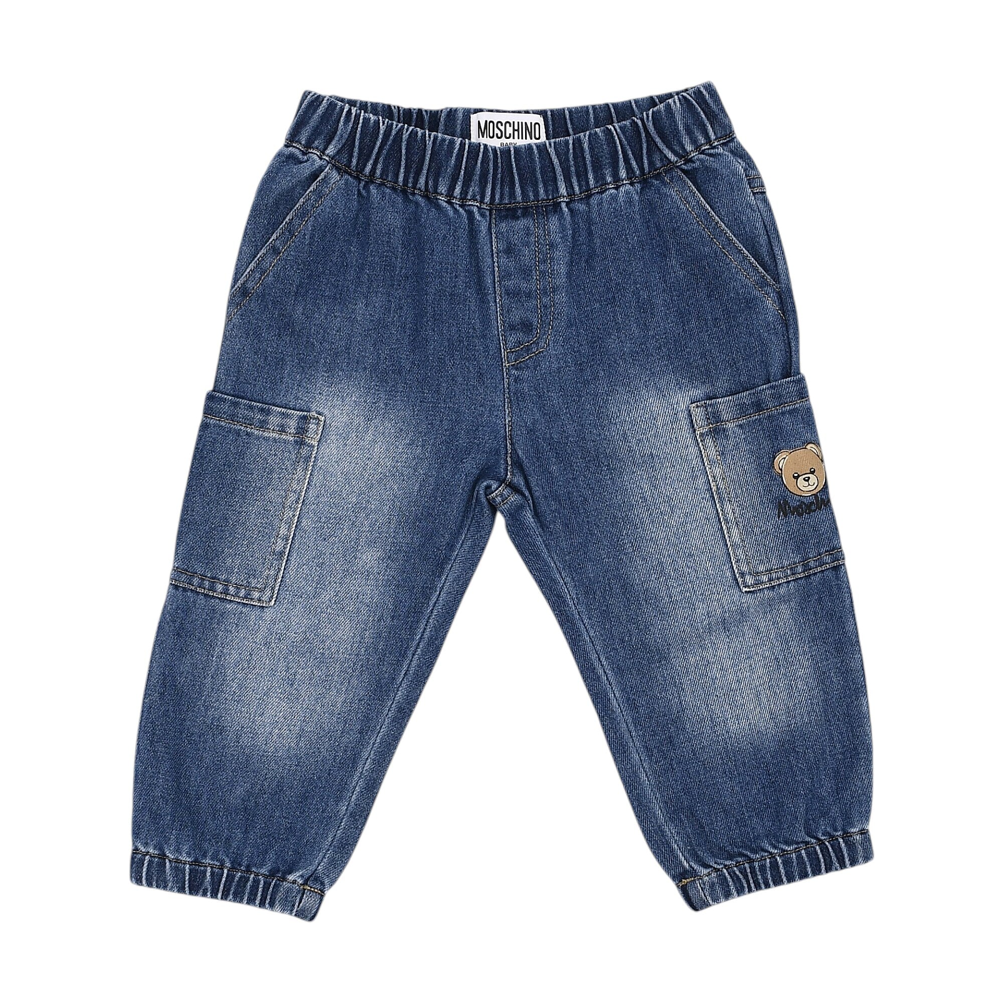 Blue denim jogger trousers with elasticated waist and cuffs. Features two slanted front pockets and two cargo pockets, the ri
