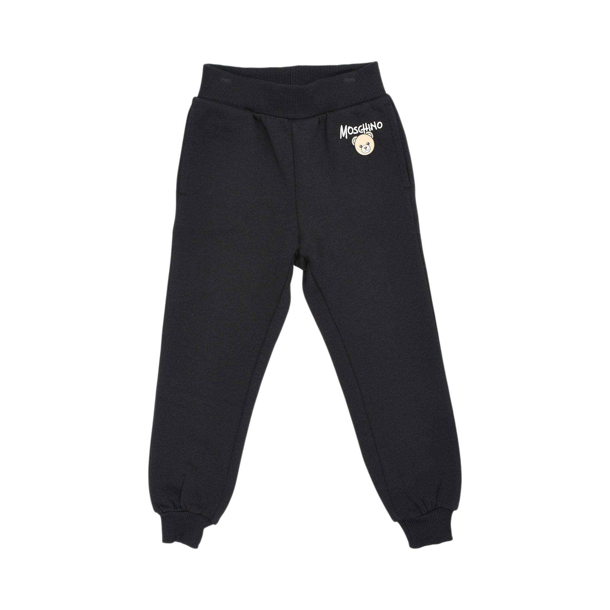 Black jogging suit pants with ribbed elastic waistband and cuffs, featuring a white Moschino logo and a light brown cartoon b