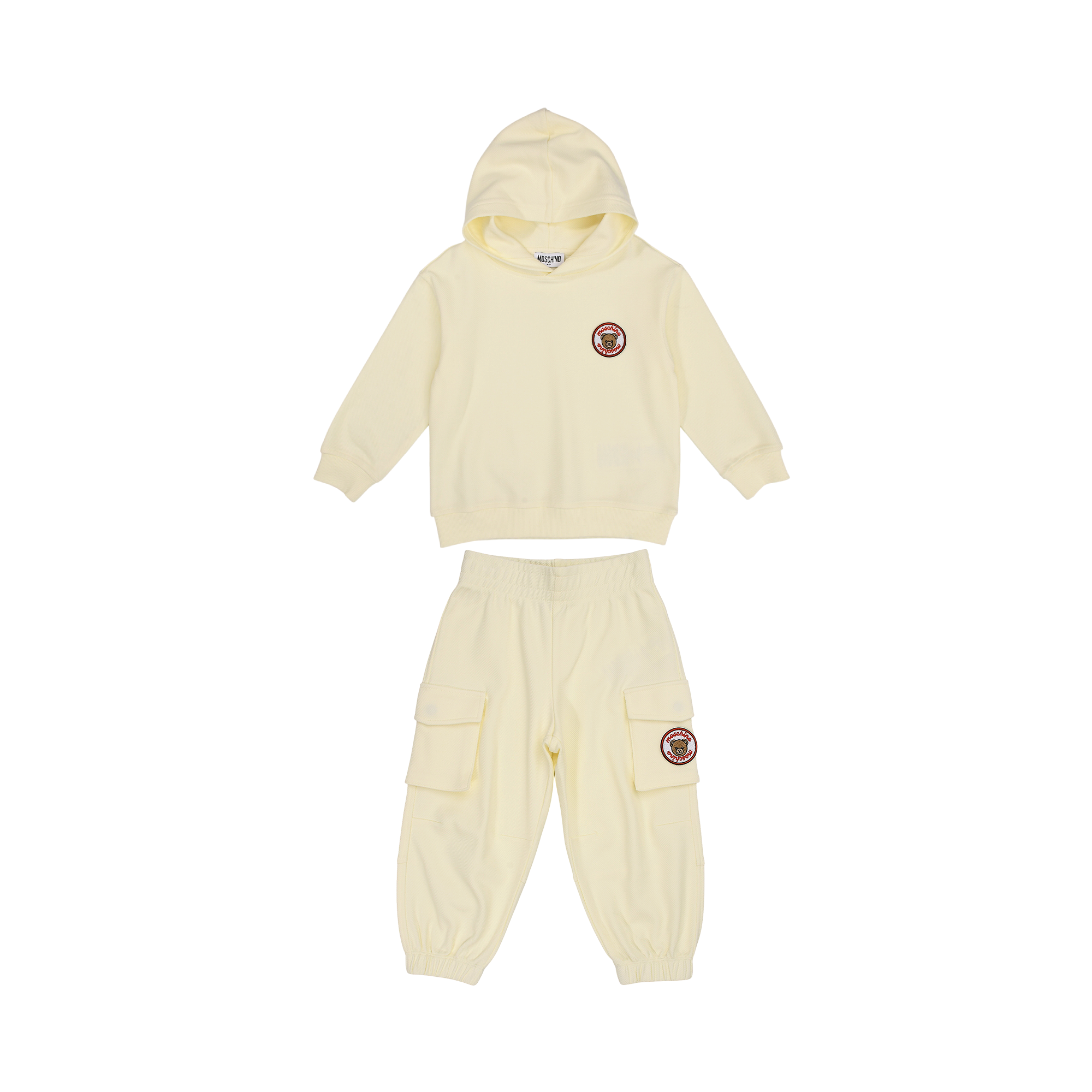 Cream Moschino Kids jogging suit, including a hooded sweatshirt with a teddy bear patch and cargo jogging bottoms.