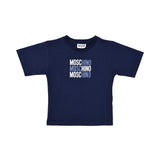 Front view of a navy blue Moschino Kids t-shirt featuring three stacked "Moschino" logos in white, light blue, and dark blue on the center chest.