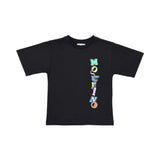Front view of a black Moschino Kids t-shirt featuring a vertical colorful logo on the left side with letters in various fonts and styles.