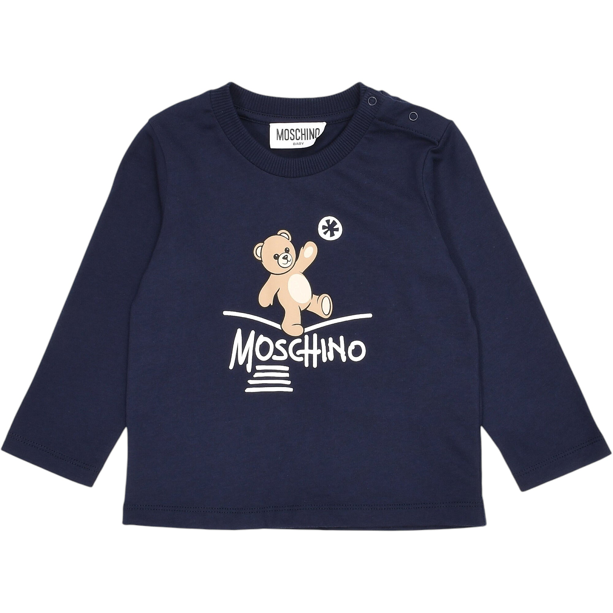 Navy long-sleeved baby T-shirt with a round neck and two shoulder snap buttons. Features a beige teddy bear graphic and white