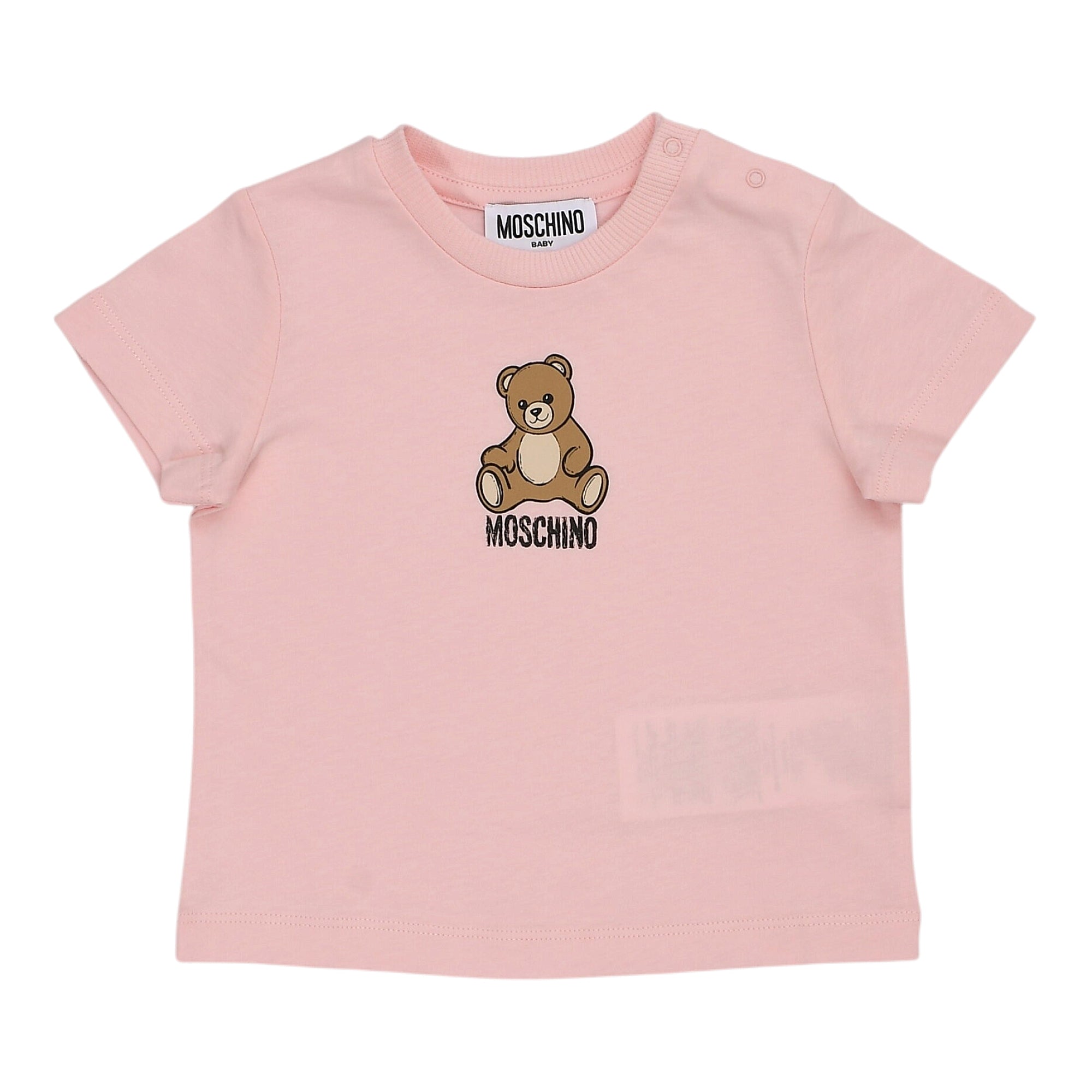 Pink short-sleeved baby t-shirt with a ribbed crew neck, snap buttons on the left shoulder, and a brown teddy bear graphic wi