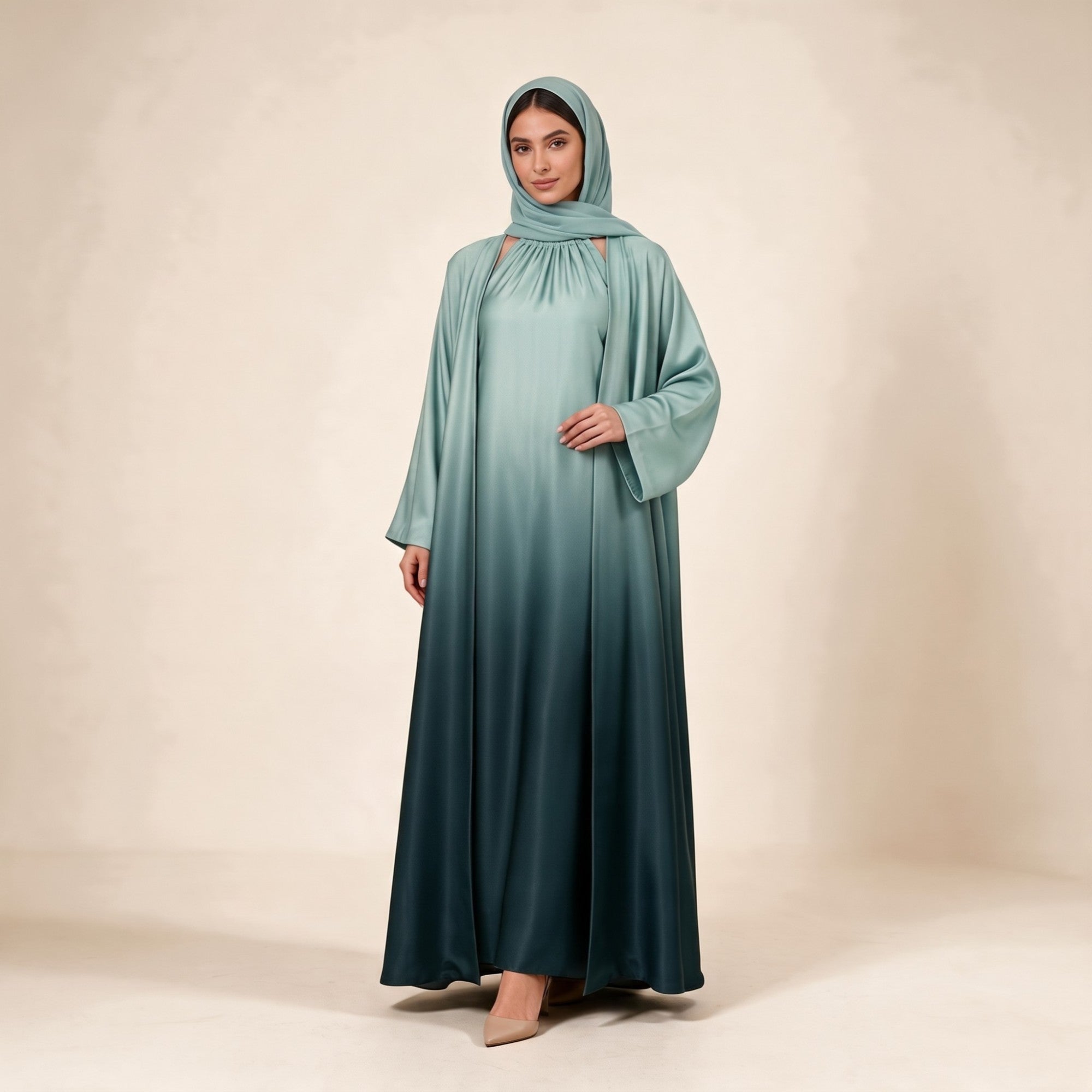Ombre green abaya set. Includes a light green inner dress with a gathered neckline and an open abaya with wide sleeves.