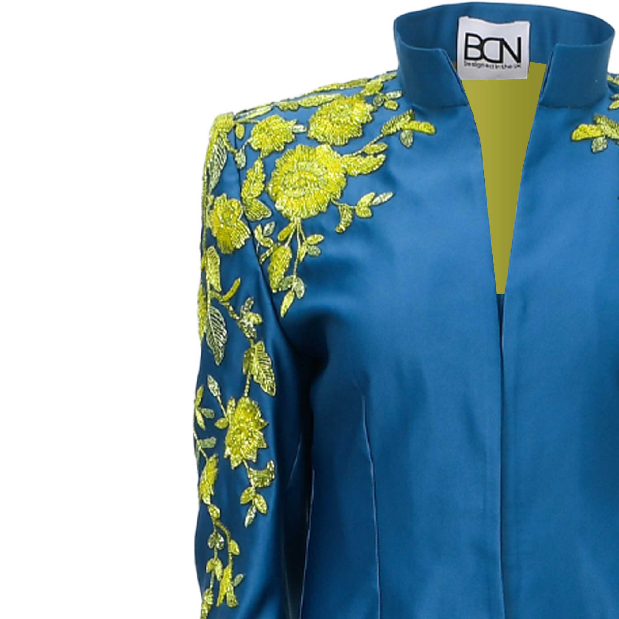 Teal kaftan with a stand-up collar and V-neck, featuring extensive lime green floral embroidery on the left shoulder and slee