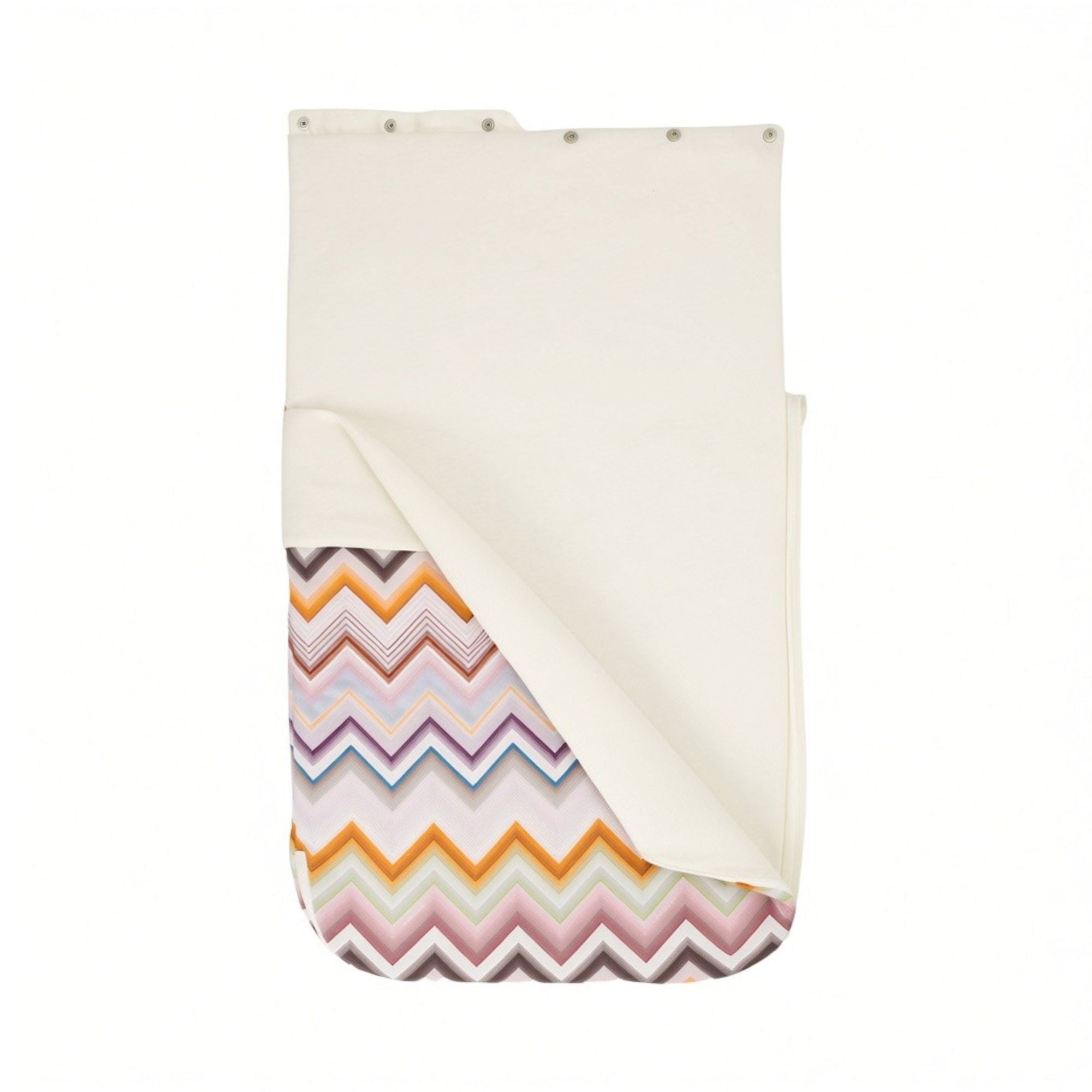 Cream baby nest with a multicolor zigzag pattern revealed on the inside bottom, featuring silver-toned snaps along the top ed