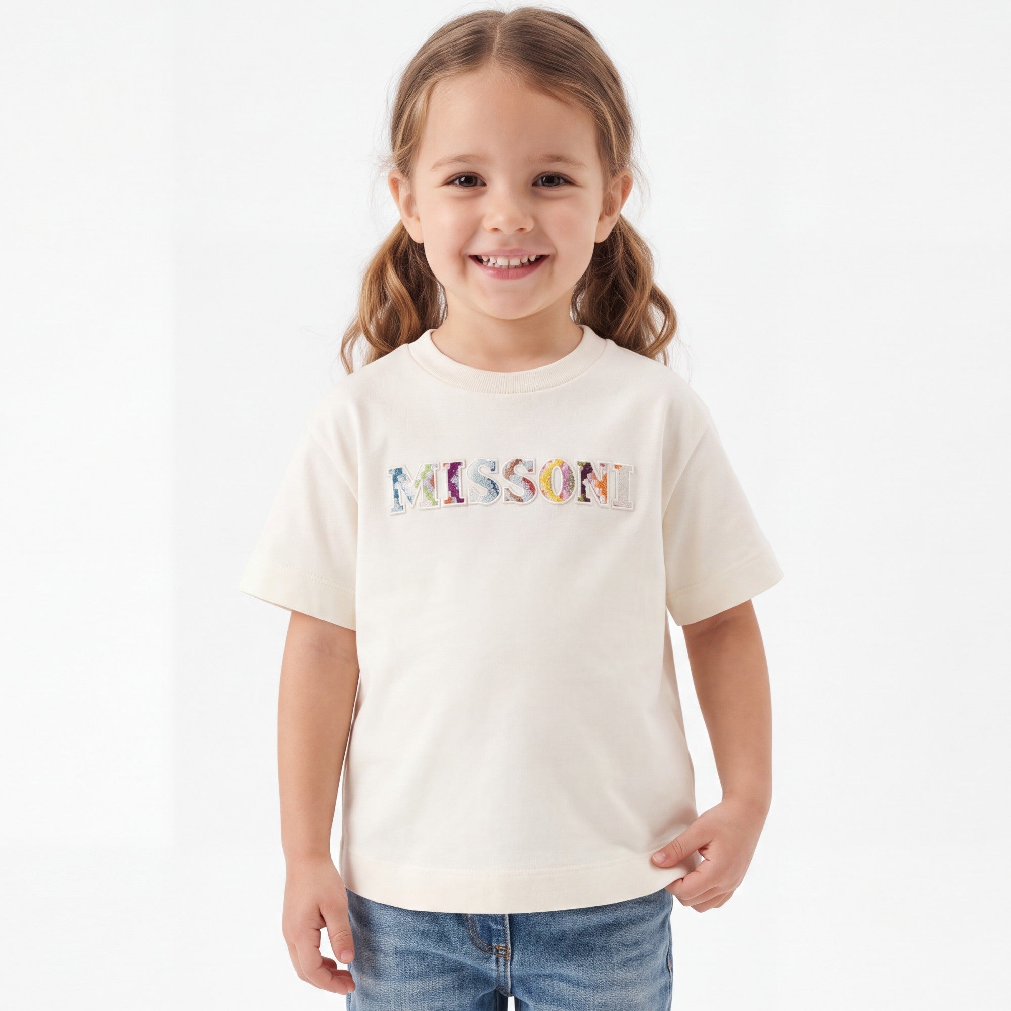 Ivory short-sleeved t-shirt with a crew neck. The word 'MISSONI' is embroidered on the chest with colorful patterned letters.