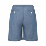 Medium chambray Bermuda shorts with elastic waist, two back welt pockets with white buttons, and a small embroidered logo.