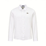 Off-white long-sleeve button-up shirt with a textured fabric, standard collar, and a small dark winged emblem on the left che