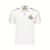 Off-white short-sleeved polo shirt with a 3-button placket, dark brown shoulder stripes, and an embroidered gold-toned eagle