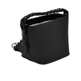 The MUNI Braided Handle Bucket Bag, a sophisticated blend of sculptural design and artisanal texture.