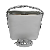 The MUNI Braided Handle Bucket Bag, a sophisticated blend of sculptural design and artisanal texture.