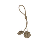 leather bag charm by MUNI featuring a large spherical monkey fist knot at the bottom, smaller coiled knot accents, and a long attachment loop against a white background.