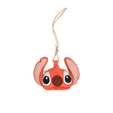 A handcrafted orange leather bag charm shaped like the character Stitch from Disney, featuring pink ears, large black eyes, and a knotted leather attachment cord, presented on a white background.