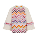 Ivory knit top with wide raglan sleeves. The back features a large multicolor chevron pattern with 'MISSONI' woven in. Smalle