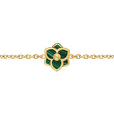 A close-up horizontal macro shot focusing on the intricate construction of the green malachite flower blossom, its secure link connections, and the polished gold-plated cable chain.