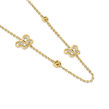 Detailed diagonal macro shot highlighting the dual-layer yellow-gold and silver-toned cut-out butterfly charms alongside the polished three-dimensional SH monogram station blocks.
