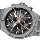 Extreme close-up of the textured charcoal waffle grid face, detailing the rose gold applied indicators, the concentric circular graining on the multi-function subdials, and the precision luminescent paint fill.