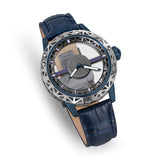 Diagonal overhead shot displaying the watch's see-through crystal center, the luminous sword-style hands, and the natural grain texture of the blue leather band.