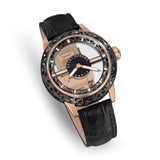 Diagonal overhead shot displaying the watch's see-through crystal center, the luminous rose gold sword-style hands, and the natural grain texture of the black leather band.