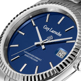 A macro high-detail macro shot of the Guy Laroche Rosalie dial, highlighting the crisp blue finish, silver-tone hands, the GL monogram seconds hand counterbalance, and the bordered date window at 3 o'clock.