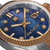 A high-detail macro close-up of the Guy Laroche Rose dial face, emphasizing the cloudy, natural iridescence of the blue Mother of Pearl, the framed diamond indices, and the crisp rose gold hands.