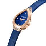 Close-up profile view focusing on the leaf-shaped rose gold hands, the inset diamonds on the upper chevron lug, and the low-profile crown against the deeply textured blue dial.