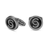 A close-up studio shot of the Orlando cufflink face, highlighting the high-gloss black lacquer inlay set into the dark grey monogram borders.