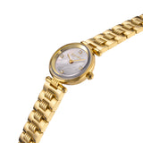 A high-angle close-up perspective shot of the Escada Scarlett watch, emphasizing the high-clarity sapphire crystal, the natural pearlescent texture of the dial, and the crisp reflections along the golden hands and links.
