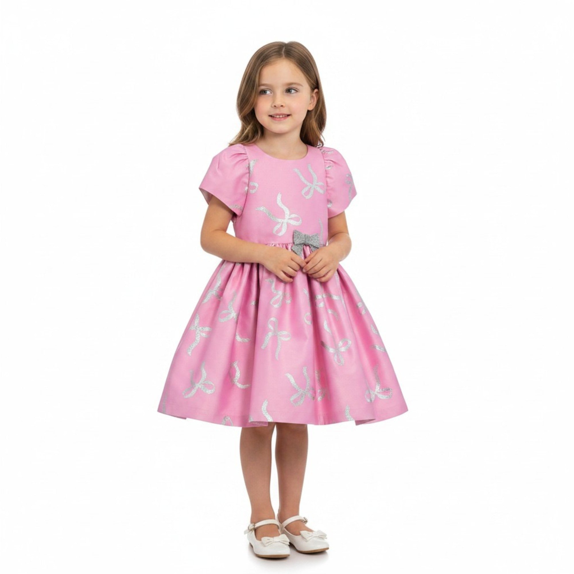 Back full-length view of the Mamaluma girls pink dress highlighting a large, structured satin statement bow at the waistline and a clean, concealed zipper closure.