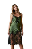 Model wearing Marjolaine olive green silk midi slip dress with black lace appliqué available at BLUE SALON.
