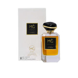 Front view of Marwa Ghassan Patchouli Extrait De Parfum 100ml bottle with amber-colored liquid, gold-rimmed black cap, and its white embossed luxury packaging box.